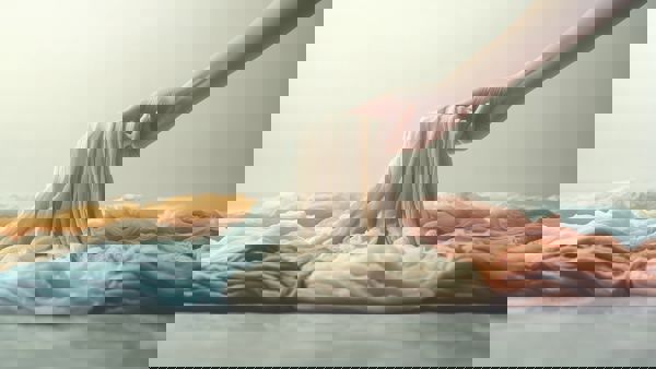 Steinmeier A Persons Hand Is Shown Picking Up Several Folded C 787C193a A763 433D A533 931A0a8fa8a8