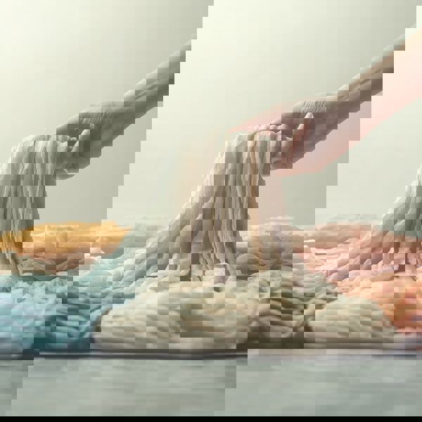 Steinmeier A Persons Hand Is Shown Picking Up Several Folded C 787C193a A763 433D A533 931A0a8fa8a8